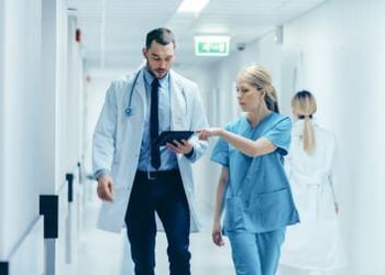 Doctor-and-nurse-using-digital-tablet