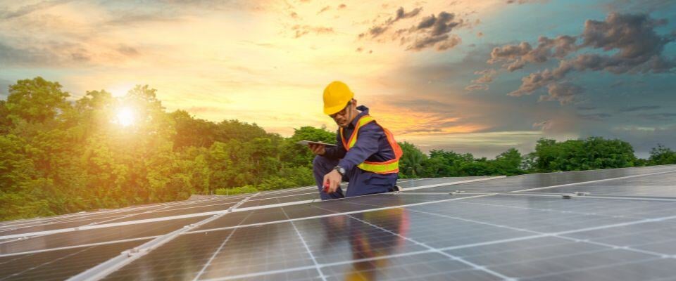 Building-worker-on-top-of-solar-panels - Copy