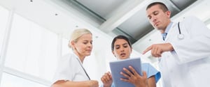 Healthcare-workers-using-digital-tablet