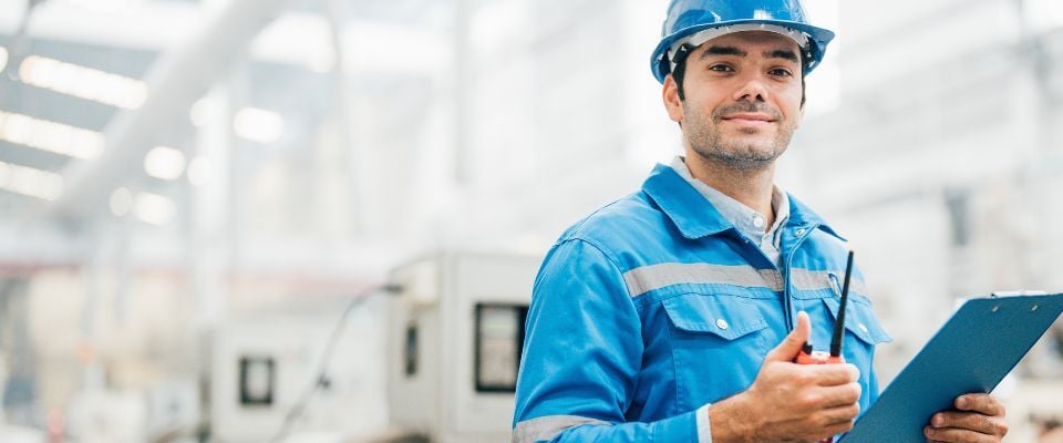 Maintenance-worker-holding-clipboard