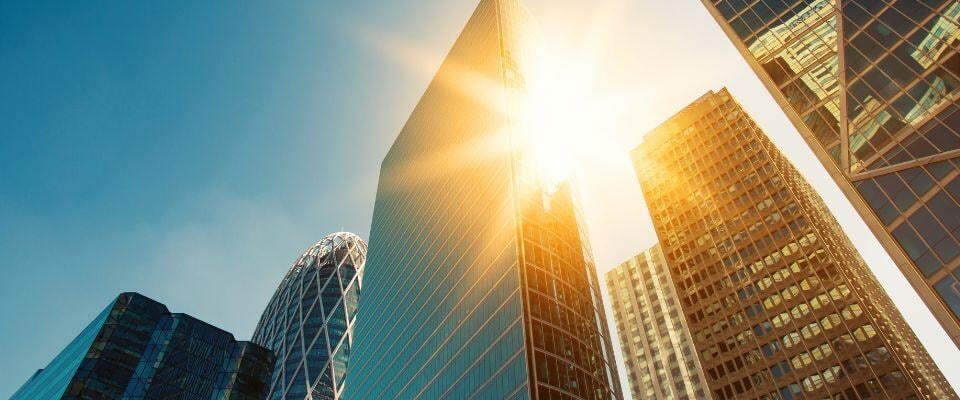 Outdoor-shot-of-glass-building-at-sunset
