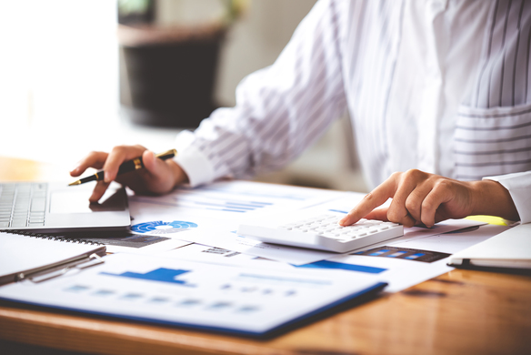 accountant-analyzing-charts-and-using-calculator-2026-09-22-03-16-14-utc