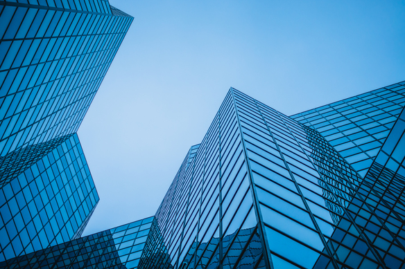 blue-glass-buildings-reaching-towards-the-sky-2026-09-24-05-06-46-utc