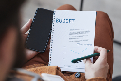 budget-analysis-with-a-mobile-phone-at-work-2026-09-21-21-31-35-utc