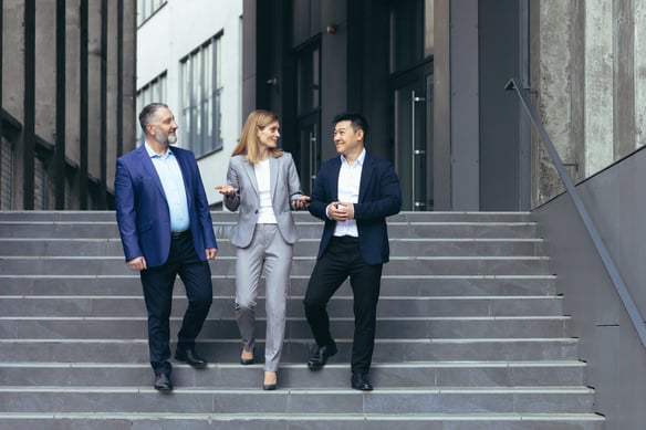 business-professionals-talking-while-walking-down-2026-09-22-03-35-12-utc
