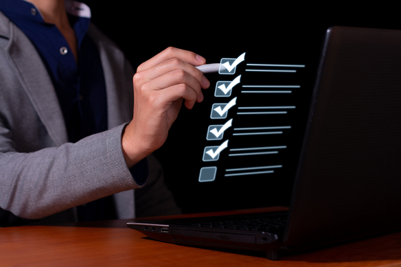 businessman-completing-virtual-checklist-on-laptop-2026-09-21-07-12-20-utc