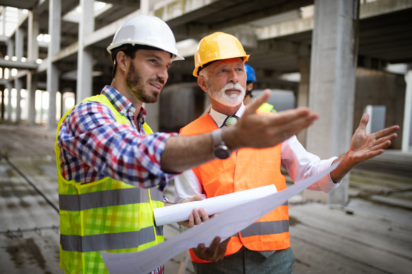construction-workers-reviewing-blueprints-at-build-2026-09-24-07-57-49-utc