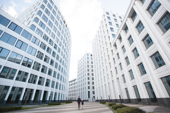 couple-walks-near-modern-architecture-on-sunny-day-2026-09-23-02-23-16-utc