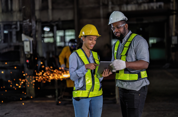 factory-workers-discuss-plans-using-tablet-technol-2026-09-22-17-16-30-utc