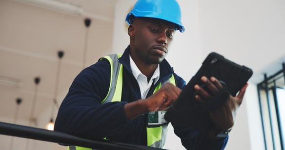 focused-professional-man-in-safety-gear-using-a-di-2026-09-25-07-05-49-utc