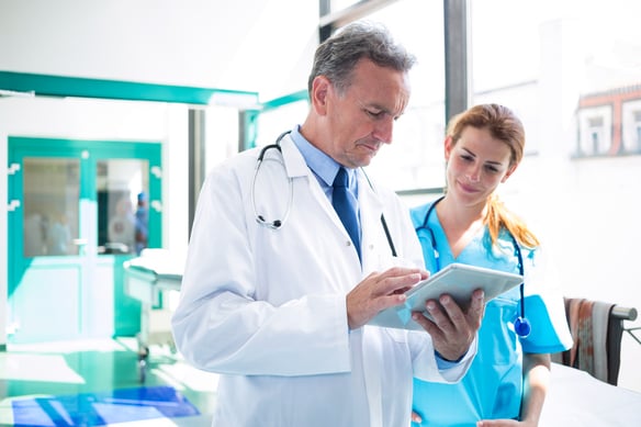 medical-professionals-examining-data-on-a-tablet-2026-09-24-13-55-31-utc