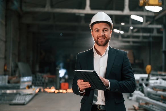 professional-man-in-hard-hat-holding-tablet-indoor-2026-09-22-02-56-16-utc