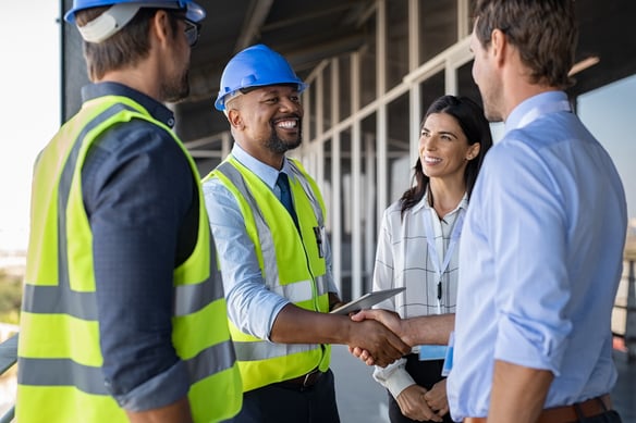 professionals-shaking-hands-at-a-construction-site-2026-09-21-11-19-03-utc
