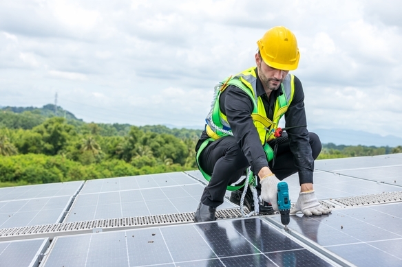solar-panel-technician-installing-panel-on-roof-2026-09-24-11-35-05-utc