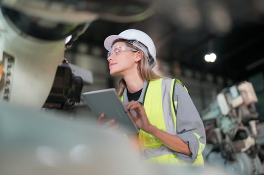 woman-engineer-inspecting-machinery-with-digital-t-2026-09-21-15-26-08-utc