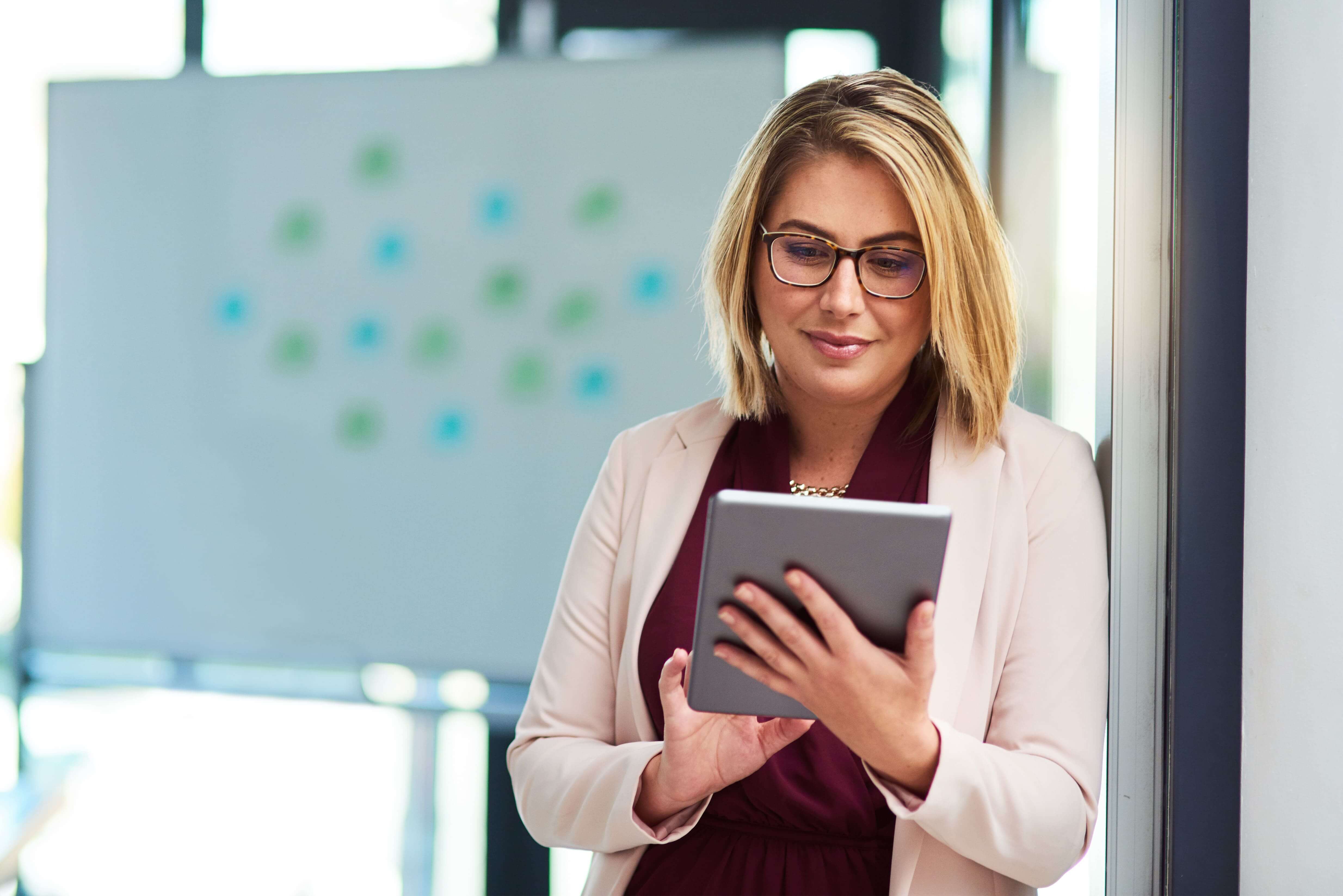 woman-uses-a-tablet-in-bright-modern-office-2026-03-25-02-52-37-utc