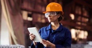 Woman With Orange Hard Hat Using Tablet
