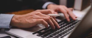 Man-typing-on-laptop