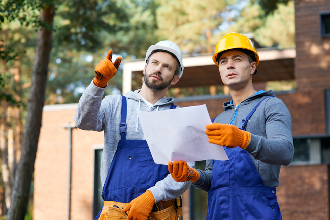 construction-men-reviewing-plans-at-building-site-2026-09-24-09-40-35-utc