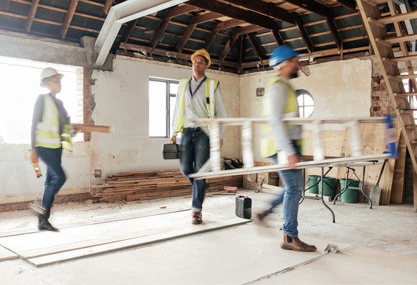 construction-workers-carry-materials-at-job-site-2026-09-24-14-24-09-utc