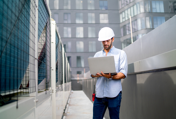 engineer-inspecting-hvac-system-with-laptop-comput-2026-09-22-00-21-21-utc (1)