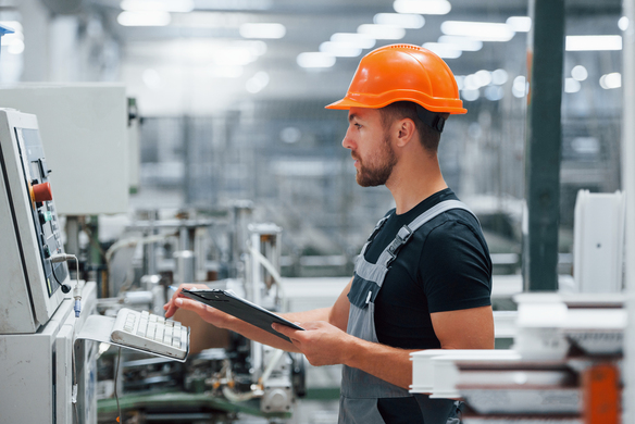 man-controls-machine-at-modern-industrial-factory-2026-09-22-02-56-30-utc