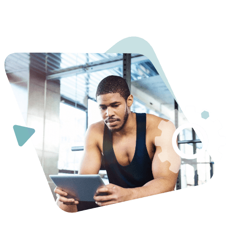 Man In Gym Using Tablet